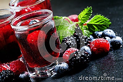 Cold summer berry tea with raspberries, blueberries, blackberrie Stock Photo