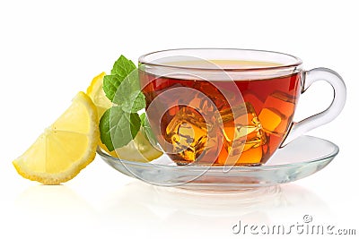 Cold tea with ice cube, lemon and mint Stock Photo