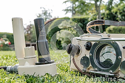 Cold war era geiger counter used for detecting radiation from nuclear weapon fallout. Editorial Stock Photo