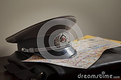 Cold War officer cap on brief case Stock Photo