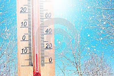 Cold winter weather - 10 degrees Celsius. Thermometer in winter frosty weather in the snow shows low temperatures - minus ten. Low Stock Photo