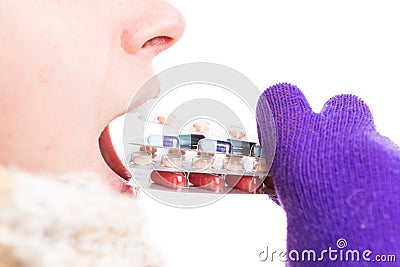 Cold woman taking many pills as medicine abuse concept Stock Photo