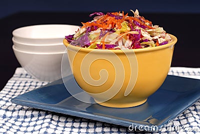 Cole slaw with carrot in a yel Stock Photo