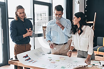 Collaboration is a key to best results. Group of young confident Stock Photo