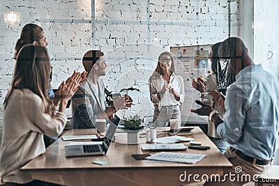 Collaboration is a key to best results. Modern young business pe Stock Photo