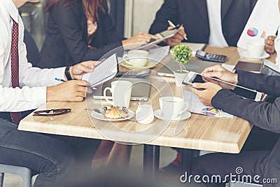 Collaboration Marketing Team Collaborate in office meeting. Group of people using smartphone working Sales Team. Marketing Stock Photo