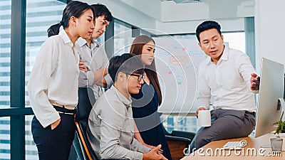 Collaborative process of multicultural businesspeople using computer presentation and communication meeting brainstorming ideas Stock Photo