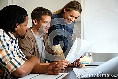 Collaborative process of multicultural skilled people during brainstorming meeting in office Stock Photo