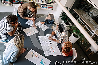Collaborative process of multicultural skilled people during brainstorming meeting in office Stock Photo