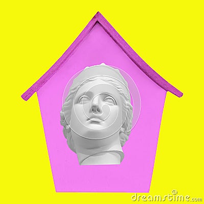 A collage of contemporary art. The plaster head of the sculpture is in a pink house on a yellow background. The concept of social Editorial Stock Photo