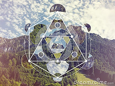 Collage with the mountains and forest and the sacred geometry symbol Stock Photo