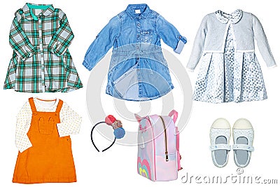 Collage set of little girls summer clothes isolated on a white background. The collection of stylish dresses, a denim dress, shoes Stock Photo