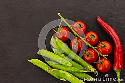 Collage vegetable set pod pea green branch tomato chili pepper asia recipe black background Stock Photo