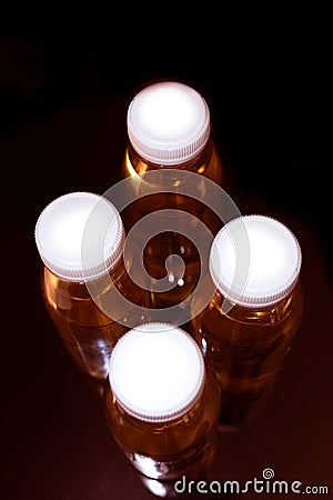 collagen bottles on black background Stock Photo