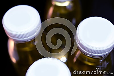 collagen bottles on black background Stock Photo