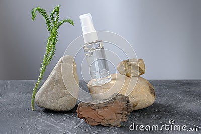 Collagen gel in unbranded bottle on natural rocks Stock Photo
