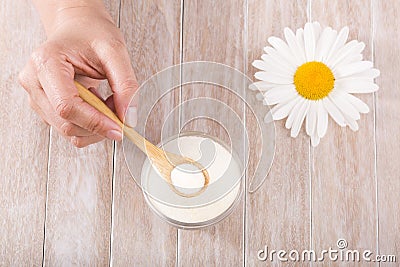 Collagen protein powder in the spoon - Hydrolyzed. Stock Photo