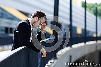 Collapse of career of young businessman, stress and despair. Market decline, financial problems Stock Photo