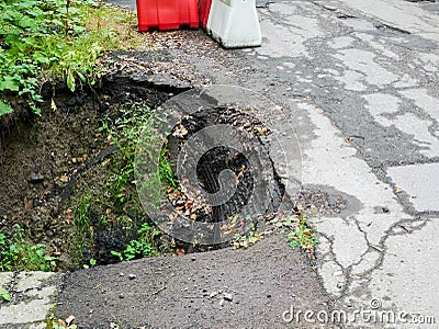 Collapsed dangerous asphalt road , small bridge Stock Photo