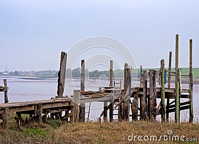 Collapsed wooden jetties Stock Photo