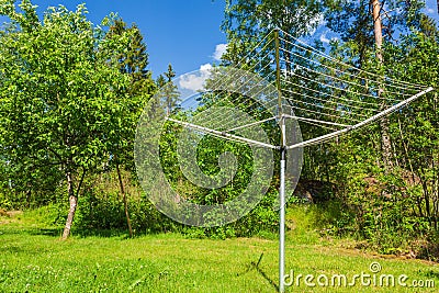 Collapsible outdoor clothes dryer view. Rotary Washing Line Airer Clothes Dryer aluminum. Stock Photo