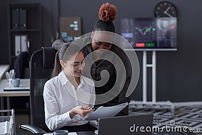 Colleagues analyzing financial documents Stock Photo