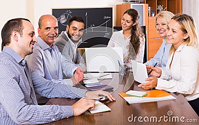 Colleagues discussing price development at office Stock Photo