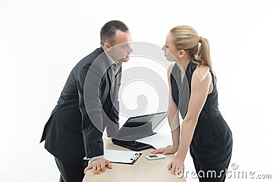 Colleagues discussing something by the table with Stock Photo