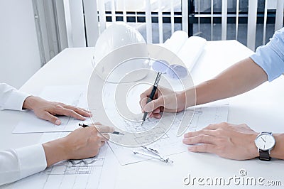 Colleagues interior designer Corporate Achievement Planning Design on blueprint Teamwork Concept with compasse Stock Photo