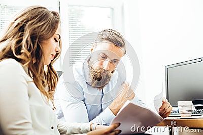 Colleagues talking about reports and finance Stock Photo