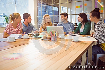 Colleagues using laptop at office Stock Photo