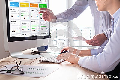 Colleagues working on agile product development board with scrum or kanban framework, lean methodology, iterative or incremental Stock Photo