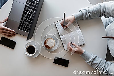 Colleagues are working remotely on a creative project in an informal setting. Teamwork. Business meeting of two successful people Stock Photo