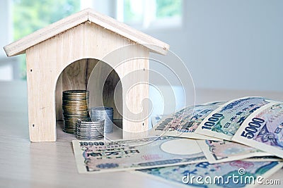 Collect money to build a house concept Stock Photo