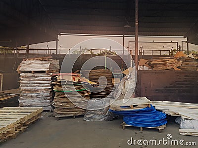 Collected area of used scrap cardboard paper and wood pallets from general waste management industry Stock Photo