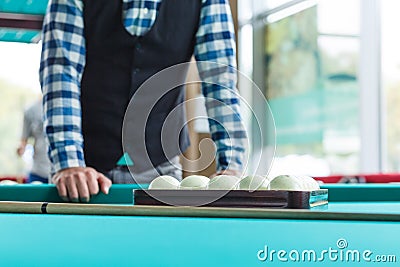 The collected pyramid of balls in the triangle on the table Stock Photo