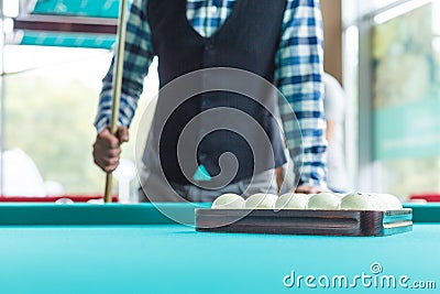 The collected pyramid of balls in the triangle on the table Stock Photo