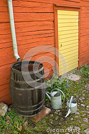 Collecting water at the back of the garden. Sweden Stock Photo