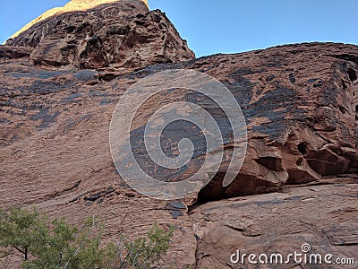 Collection of ancient petroglyphs on mountain in Valley of Fire Nevada Stock Photo