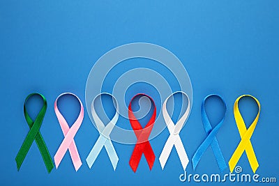 Collection of awareness ribbons on blue. World cancer day Stock Photo