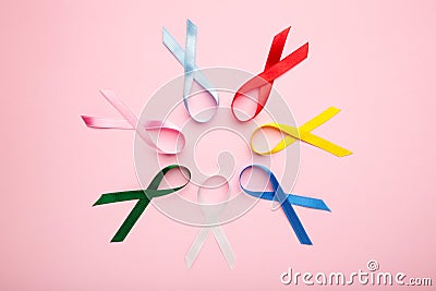 Collection of awareness ribbons on pink. World cancer day Stock Photo