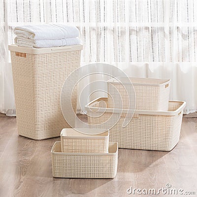 Collection of baskets and bins arranged on the floor. Stock Photo