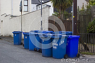 A collection of Blue bins containing re-cyclable waste Stock Photo