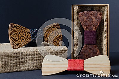 Collection of bow ties made of handmade wood, on a black background Stock Photo
