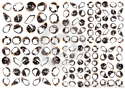 Collection of burnt holes in a piece of paper isolated on white Stock Photo