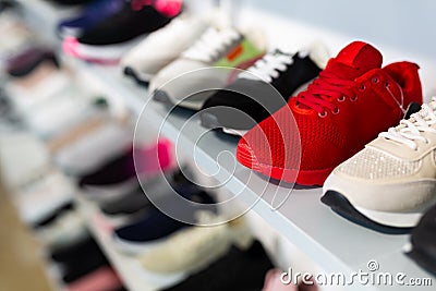 Collection of canvas sneakers for sports and hiking in shoe boutique Stock Photo