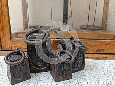A collection of cast iron vintage lb weights front view Stock Photo
