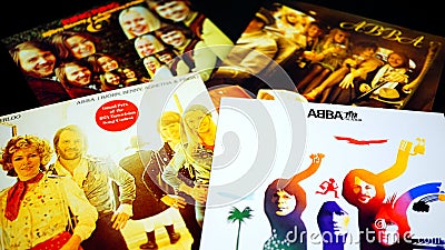 Collection of cd covers of the famous Swedish ABBA group. one of the most successful and beloved pop groups Editorial Stock Photo