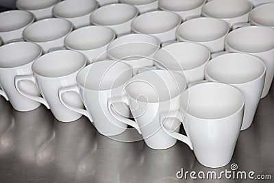 Collection of coffee mugs in office Stock Photo