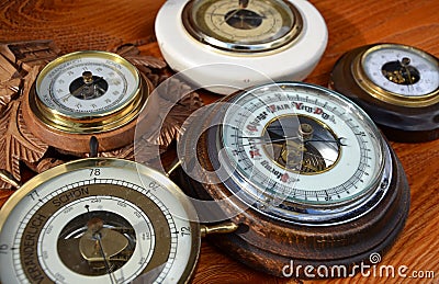 A collection of five different barometers determines weather forecasts based air pressure Stock Photo